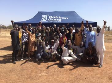 Image of farmer and users of Babban Gona Farmer Services
