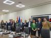 Image of a group of people standing. 